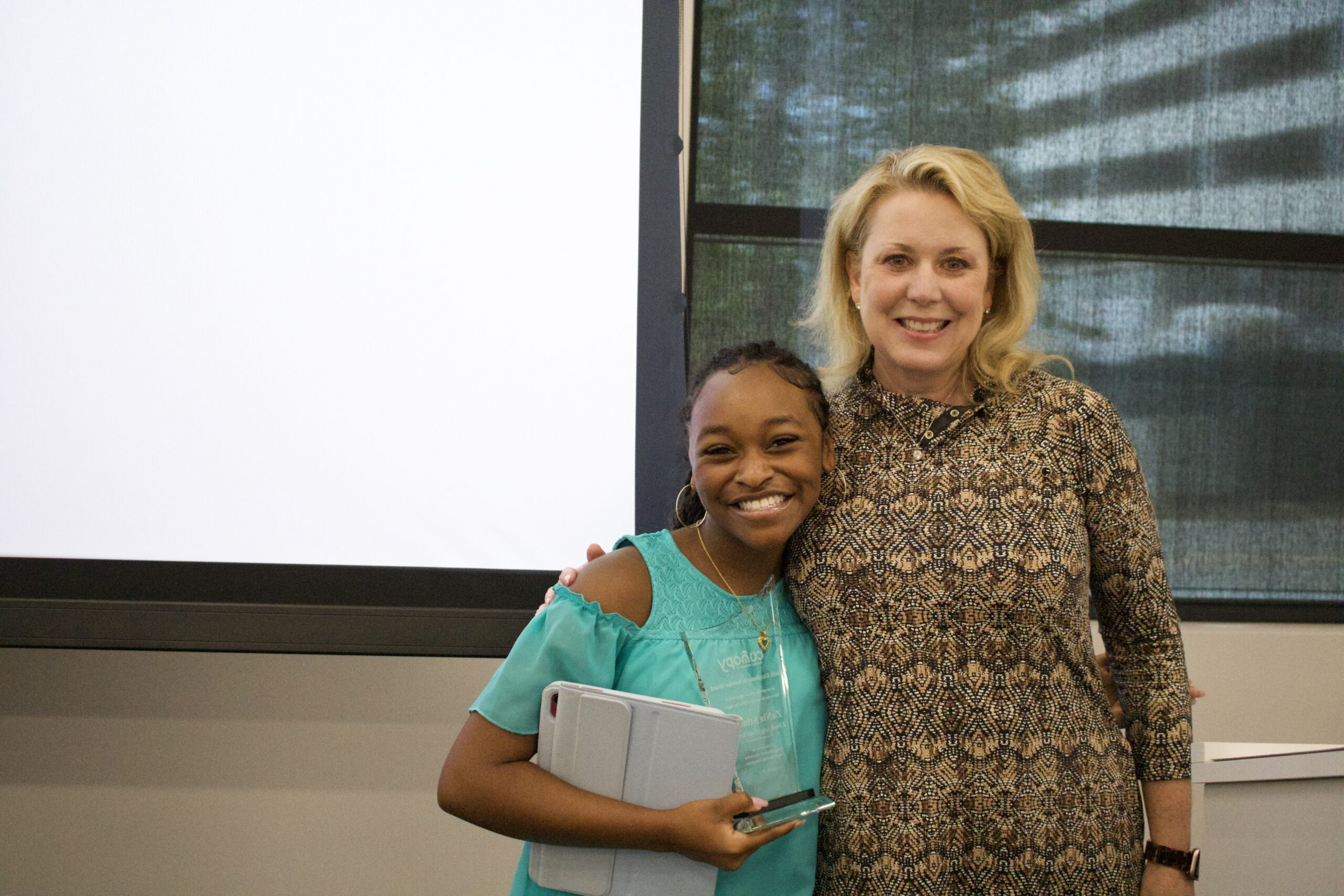 ZaNia Stinson poses with Canopy 2023 President Tiffany Johannes